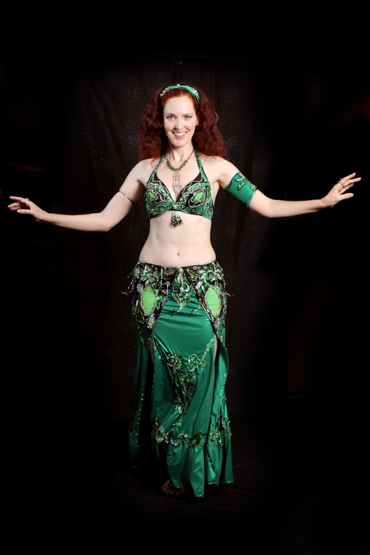 Tall red head belly dancing
